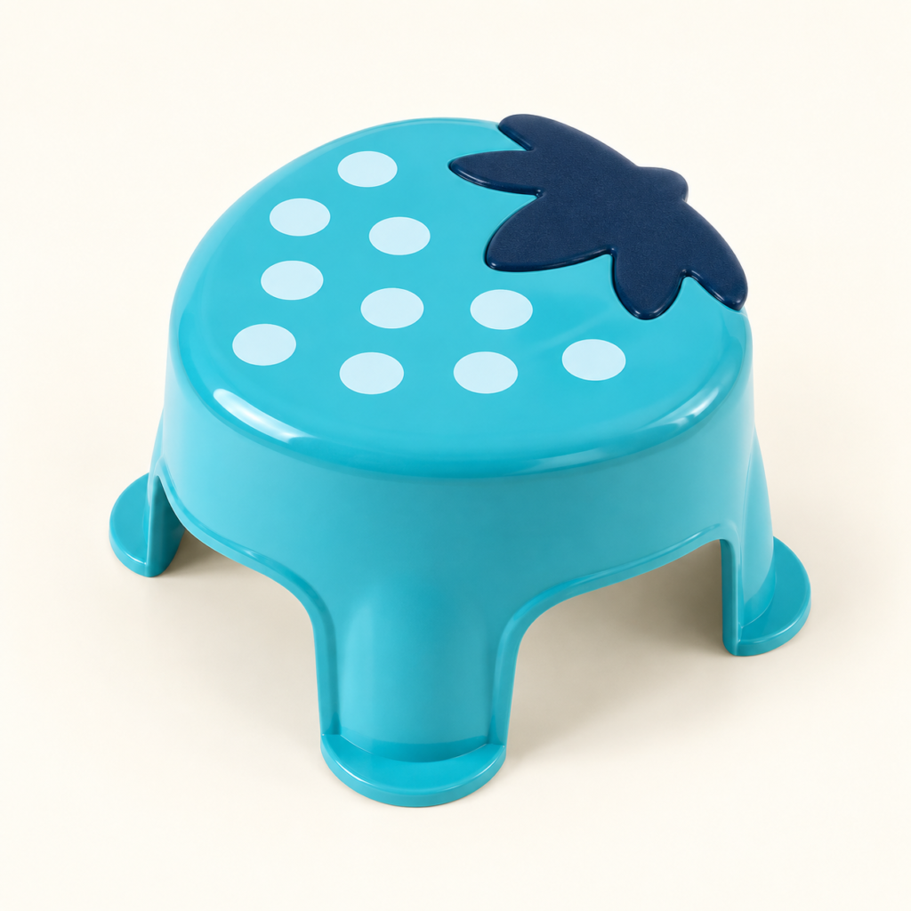 Turquoise strawberry-shaped plastic stool on an ivory background